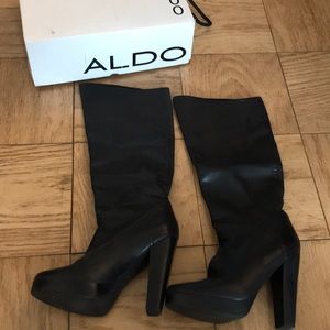 Black leather high heel boots